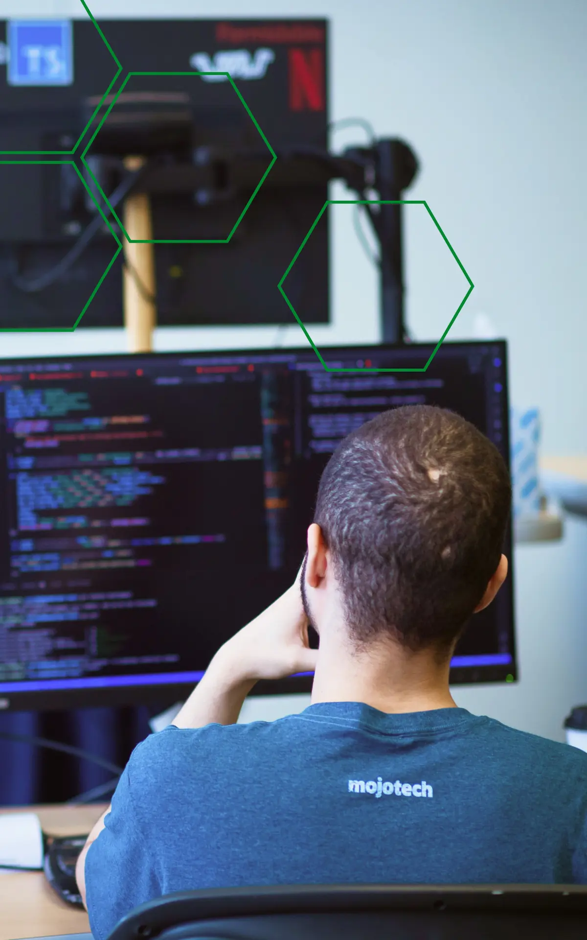 MojoTech engineer working at a computer